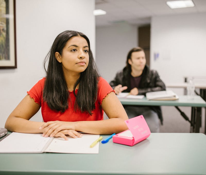 Woman Studying Inside the Classroom